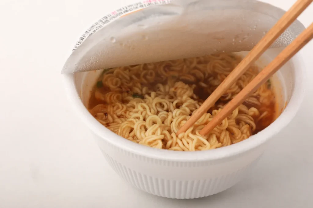 Nongshim Yukgaejang cup noodles with the lid folded halfway back.